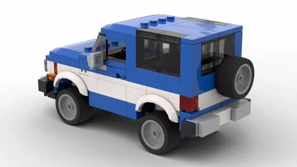 LEGO Ford Bronco II 85 scale model in two tone blue and white color scheme on white background rear view angle