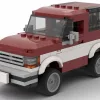 LEGO Ford Bronco II 89 scale model in two tone dark red and white color scheme on white background