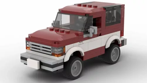 LEGO Ford Bronco II 89 scale model in two tone dark red and white color scheme on white background