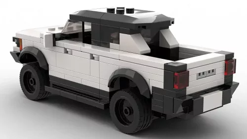 LEGO GMC Hummer EV Pickup 23 scale brick model on white background rear view angle