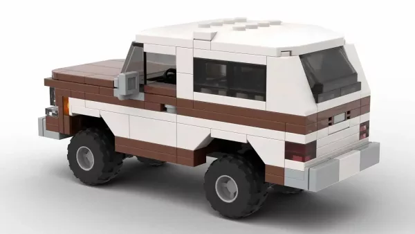 LEGO Chevrolet K5 Blazer 75 scale brick model in two tone dark brown and white paint scheme on white background rear view angle